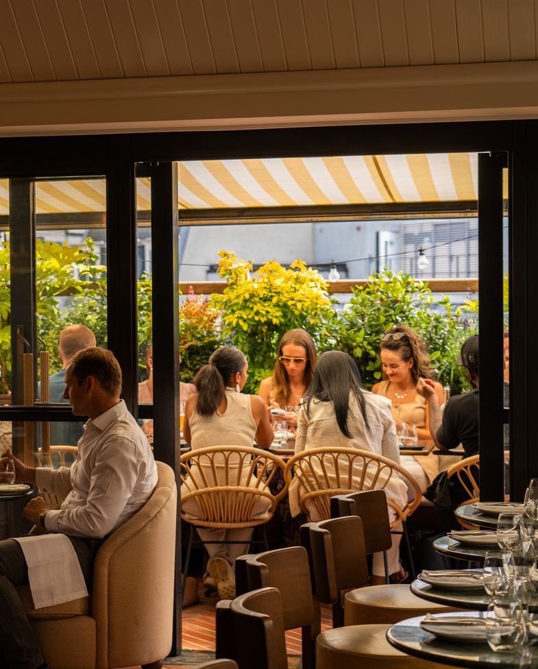 Inside Yasmin Soho overlooking the balcony restaurant